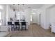Bright, open-concept kitchen featuring modern white cabinetry, quartz countertops, and stylish pendant lighting at 23046 N 88Th Way, Scottsdale, AZ 85255