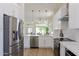 Stainless steel appliances and light colored countertops add a luxury finish to this kitchen at 23046 N 88Th Way, Scottsdale, AZ 85255