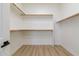 Spacious walk-in closet with ample shelving and hanging space for organized storage at 23046 N 88Th Way, Scottsdale, AZ 85255