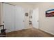 Neat bedroom featuring sliding closet doors and TV at 2361 N 156Th Dr, Goodyear, AZ 85395