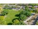 Expansive community green space with mature trees and paved walking path at 2361 N 156Th Dr, Goodyear, AZ 85395