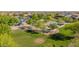 A lush community park features mature trees, walking paths, playground, and sports court in a serene neighborhood setting at 2361 N 156Th Dr, Goodyear, AZ 85395