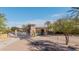 Neighborhood entry gate showcasing well-maintained landscaping and stone architecture at 2361 N 156Th Dr, Goodyear, AZ 85395