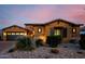 Well-maintained home with stone accents, neat landscaping, and a spacious two-car garage at 2361 N 156Th Dr, Goodyear, AZ 85395