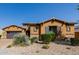 Well-maintained home with stone accents, neat landscaping, a driveway, and a spacious two-car garage at 2361 N 156Th Dr, Goodyear, AZ 85395