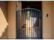 Wrought iron entry gate to the private, enclosed front courtyard of the home at 2361 N 156Th Dr, Goodyear, AZ 85395