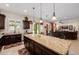 Bright, open-concept kitchen with an island and seamless flow to the outdoor living area at 2361 N 156Th Dr, Goodyear, AZ 85395
