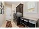 Convenient laundry room with modern washer and dryer, built-in storage, and a bright window at 2361 N 156Th Dr, Goodyear, AZ 85395