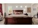 Comfortable main bedroom showcasing a bed with decorative pillows and side tables with lamps at 2361 N 156Th Dr, Goodyear, AZ 85395
