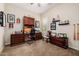 Dedicated home office with built-in desk, shelving, and organized display of memorabilia at 2361 N 156Th Dr, Goodyear, AZ 85395