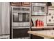 The stainless-steel oven and microwave give a sleek, modern look to this kitchen at 2361 N 156Th Dr, Goodyear, AZ 85395