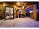 Covered patio with travertine flooring, ceiling fan, outdoor kitchen and grill perfect for entertaining and relaxing at 2361 N 156Th Dr, Goodyear, AZ 85395