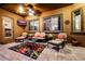Outdoor patio offering comfortable seating, ceiling fan, travertine flooring, and calming backyard views for outdoor living at 2361 N 156Th Dr, Goodyear, AZ 85395