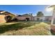 Grassy backyard with a block wall at 241 W Atlantic Dr, Casa Grande, AZ 85122