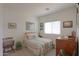 Bright bedroom with coordinated linens, ample natural light, and stylish decorations on the walls at 241 W Atlantic Dr, Casa Grande, AZ 85122