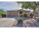 Beautiful single-story home with stone accents and mature landscaping at 241 W Atlantic Dr, Casa Grande, AZ 85122