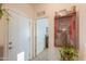 Hallway with decorative western art pieces and view into another room in well-lit setting at 241 W Atlantic Dr, Casa Grande, AZ 85122