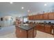 Bright kitchen features an island with bar seating and modern appliances in an open concept living space at 241 W Atlantic Dr, Casa Grande, AZ 85122
