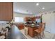 Spacious kitchen boasts an island with seating, modern appliances, ample counter space, and tiled flooring at 241 W Atlantic Dr, Casa Grande, AZ 85122