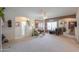 Inviting living room features neutral walls, ample natural light, and is connected to other living spaces at 241 W Atlantic Dr, Casa Grande, AZ 85122