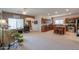 Open living room boasts a ceiling fan, neutral walls and ample natural light, adjoining the kitchen at 241 W Atlantic Dr, Casa Grande, AZ 85122