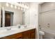 Bathroom with double sinks, spacious countertop, and vanity lighting at 2600 E Hazeltine Way, Chandler, AZ 85249