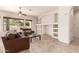 Cozy living room with neutral paint, tile floors, and a ceiling fan at 2600 E Hazeltine Way, Chandler, AZ 85249
