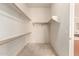 A walk-in closet with carpet, shelving, and white walls at 2600 E Hazeltine Way, Chandler, AZ 85249