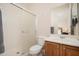 Clean bathroom showcasing a walk-in shower with glass doors and a vanity with a sink at 27196 N 129Th Dr, Peoria, AZ 85383