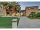 A building exterior with palm trees and a green lawn, featuring 'V's Taproom' signage for a pleasant atmosphere at 27196 N 129Th Dr, Peoria, AZ 85383