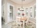 Dining room with lots of natural light and a beautiful chandelier at 27196 N 129Th Dr, Peoria, AZ 85383