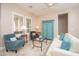 Cozy living room features comfortable seating, a white sofa, and stylish decor at 27196 N 129Th Dr, Peoria, AZ 85383