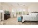 Inviting main bedroom with great natural light and a plush bed at 27196 N 129Th Dr, Peoria, AZ 85383