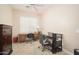 Well-lit office featuring dual desks, plantation shutters and stylish decor at 27196 N 129Th Dr, Peoria, AZ 85383