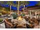 Inviting outdoor fire pit lounge area with comfortable seating and desert landscaping, perfect for relaxing evenings at 27196 N 129Th Dr, Peoria, AZ 85383