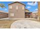 Home's back exterior showcasing a covered patio, large windows, and well-maintained yard at 2859 E Cathy Dr, Gilbert, AZ 85296