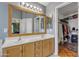 Bathroom featuring dual sinks and a walk-in closet for ample storage at 2859 E Cathy Dr, Gilbert, AZ 85296