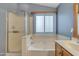 Bright bathroom complete with a bathtub and shower combination at 2859 E Cathy Dr, Gilbert, AZ 85296