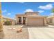 Attractive two-story home showcasing desert landscaping and a spacious two-car garage at 2859 E Cathy Dr, Gilbert, AZ 85296