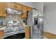 This kitchen includes stainless steel appliances and wood cabinets with plenty of counter space at 2859 E Cathy Dr, Gilbert, AZ 85296
