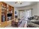Inviting living room with patio access, built-in shelves and comfortable seating at 2859 E Cathy Dr, Gilbert, AZ 85296