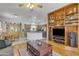 Spacious living area showcasing built-in shelving, and views of the kitchen and dining area at 2859 E Cathy Dr, Gilbert, AZ 85296