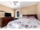 Cozy bedroom with wood dresser, floral bedding, and natural light from the window at 2942 E Mulberry Dr, Phoenix, AZ 85016