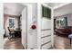 Hallway with built-in storage cabinets and open doorways to rooms with natural lighting at 2942 E Mulberry Dr, Phoenix, AZ 85016