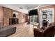Inviting living room with brick fireplace, offering a cozy and stylish area to relax at 2942 E Mulberry Dr, Phoenix, AZ 85016
