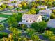 A high angle view of a suburban neighborhood with a playground and sports field at 2973 E Austin Dr, Gilbert, AZ 85296