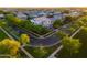 Beautiful home surrounded by lush greenery in a serene neighborhood setting at sunset at 2973 E Austin Dr, Gilbert, AZ 85296