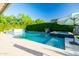 Beautiful swimming pool with hot tub, and basketball hoop, surrounded by green landscaping at 2973 E Austin Dr, Gilbert, AZ 85296