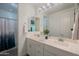 Bright bathroom features a dual sink vanity with white cabinets and a shower/tub with curtain at 2973 E Austin Dr, Gilbert, AZ 85296