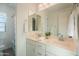 Bright bathroom features a dual sink vanity with white cabinets and a shower/tub at 2973 E Austin Dr, Gilbert, AZ 85296